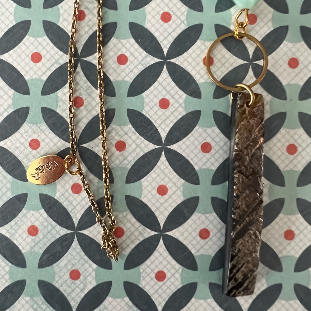 ViBella long gold colored chain with blue bead and wooden accent